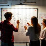 Team brainstorming ideas and sketching concepts