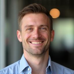 Headshot of Piotr Zieliński, Senior Graphic Designer
